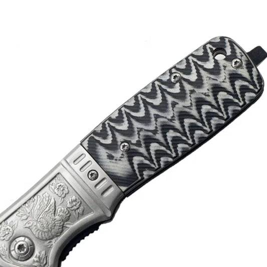 Navaja plegable con hoja negra, mango grabado y clip, 22 cm abierta